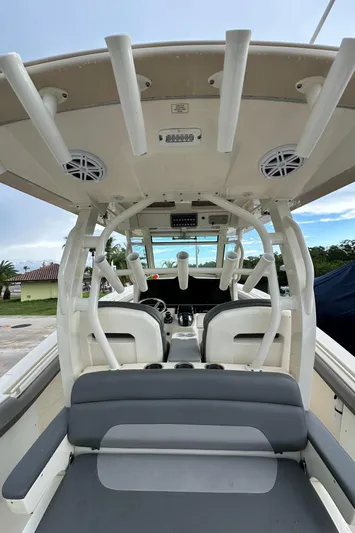  Yacht Photos Pics 2017 Scout 350 LXF boat interior with rod holders and seating.
