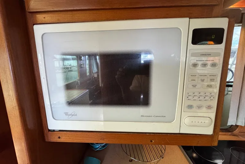 The Smithsunian Yacht Photos Pics Whirlpool microwave in 1989 DeFever 49 CPMY yacht kitchen.