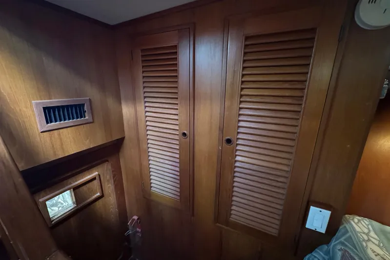 The Smithsunian Yacht Photos Pics Interior of 1989 DeFever 49 CPMY with wooden louvered doors and vent.