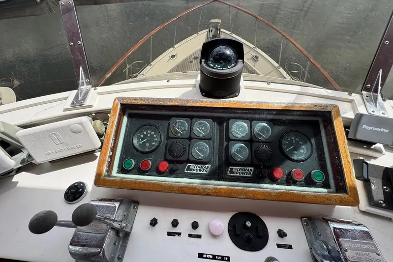 The Smithsunian Yacht Photos Pics Control panel of a 1989 DeFever 49 CPMY yacht with navigation instruments.