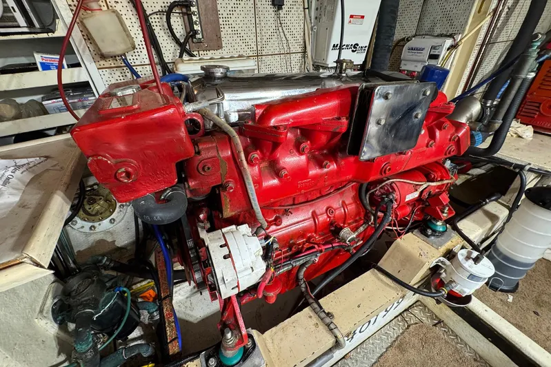 The Smithsunian Yacht Photos Pics Engine room of 1989 DeFever 49 CPMY with red marine engine.