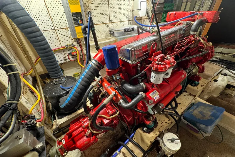 The Smithsunian Yacht Photos Pics Engine room of 1989 DeFever 49 CPMY with red marine engine and wiring.