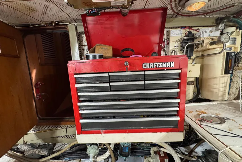 The Smithsunian Yacht Photos Pics Red Craftsman tool chest in 1989 DeFever 49 CPMY engine room, surrounded by equipment.