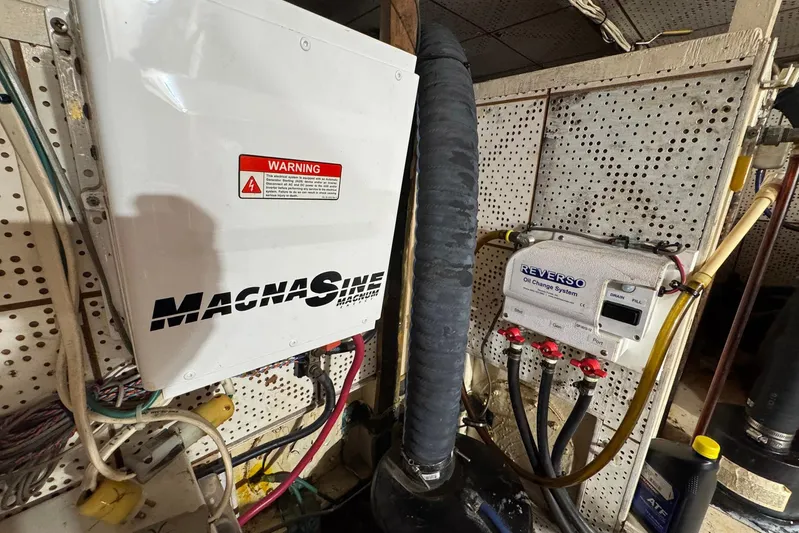 The Smithsunian Yacht Photos Pics Engine room of 1989 DeFever 49 CPMY with Magnum inverter and Reverso oil change system.