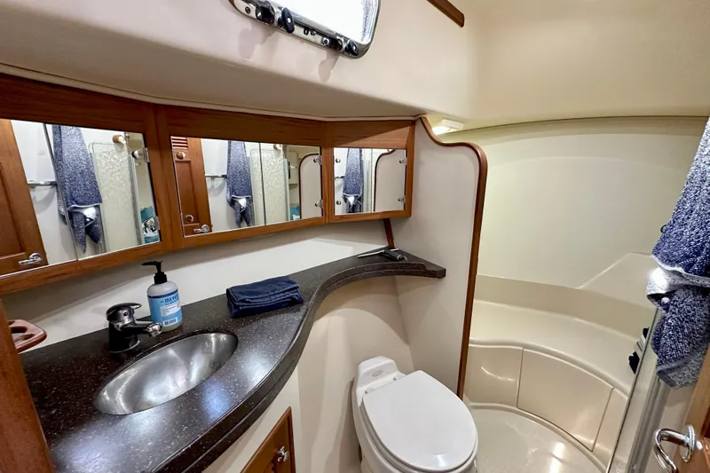 Second Wind Yacht Photos Pics Luxurious bathroom in 2006 Island Packet 440 yacht with modern fixtures and ample storage.