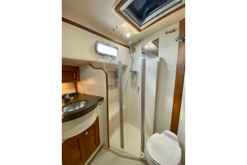 Second Wind Yacht Photos Pics Bathroom interior of 2006 Island Packet 440 yacht with shower and sink.