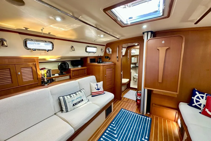 Second Wind Yacht Photos Pics Luxurious 2006 Island Packet 440 yacht interior with cozy seating and nautical decor.