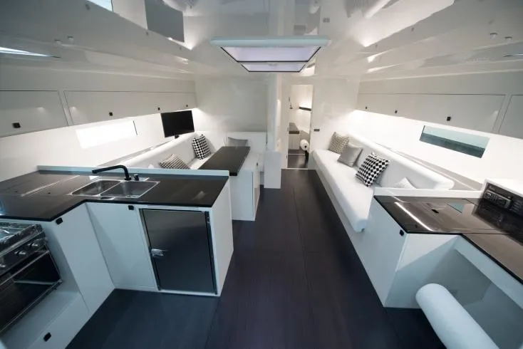 Sn Yacht Photos Pics Luxurious interior of 2015 Vismara V62 Mills yacht with modern kitchen and seating area.