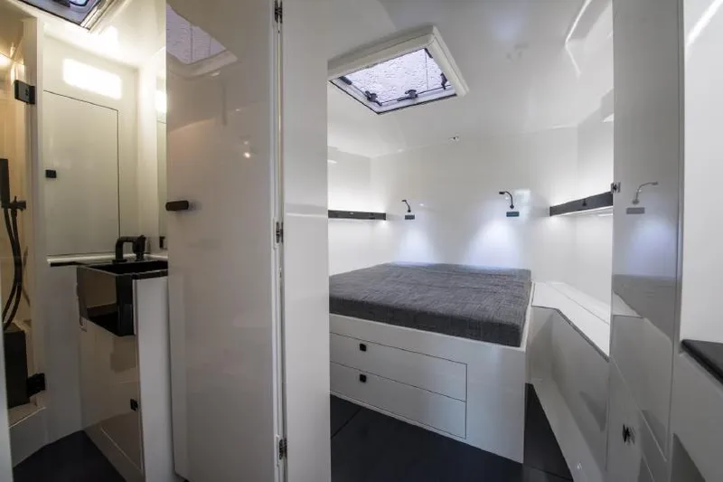 Sn Yacht Photos Pics Luxurious interior of 2015 Vismara V62 Mills yacht with modern bedroom and bathroom.