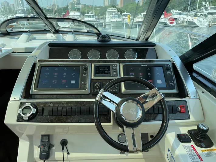  Yacht Photos Pics Dashboard of a 2013 Sea Ray 450 Sundancer yacht with modern navigation controls.