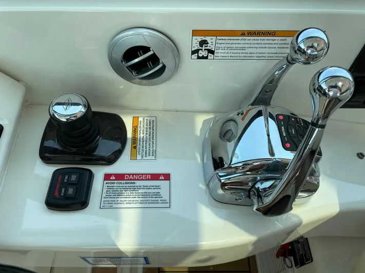  Yacht Photos Pics Control panel of 2013 Sea Ray 450 Sundancer boat with throttle and joystick.