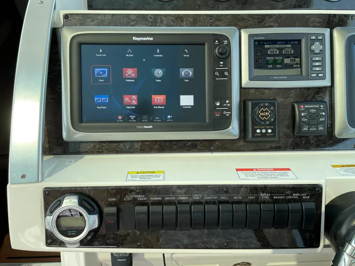  Yacht Photos Pics Control panel of a 2013 Sea Ray 450 Sundancer with navigation and system displays.