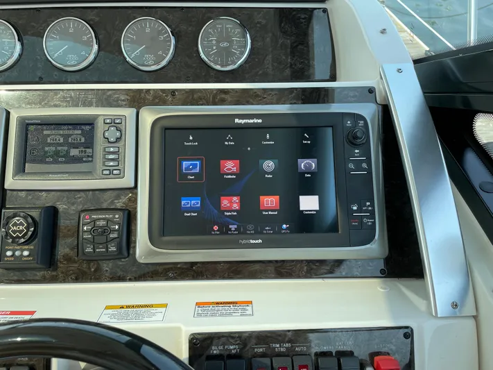  Yacht Photos Pics Control panel of 2013 Sea Ray 450 Sundancer with Raymarine navigation display.