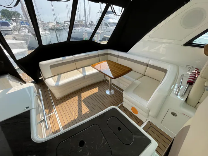  Yacht Photos Pics Luxurious 2013 Sea Ray 450 Sundancer yacht interior with elegant seating and wooden table.