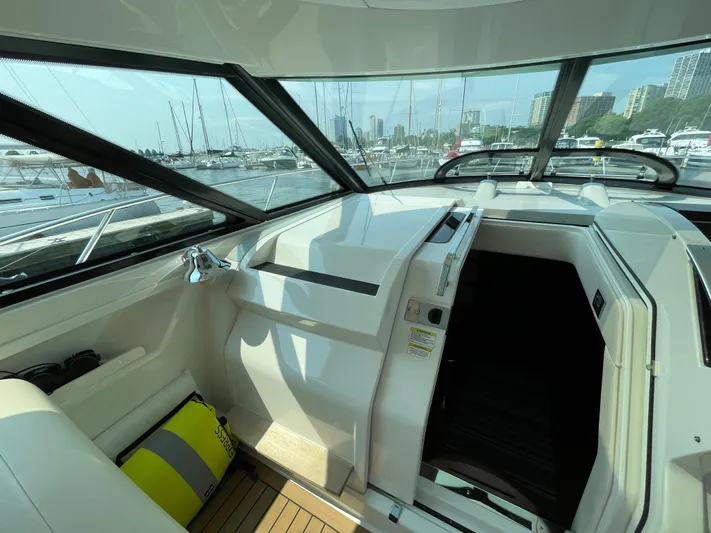  Yacht Photos Pics Interior view of 2013 Sea Ray 450 Sundancer yacht with marina background.