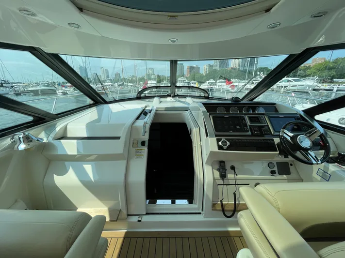  Yacht Photos Pics 2013 Sea Ray 450 Sundancer helm with modern controls and marina view.