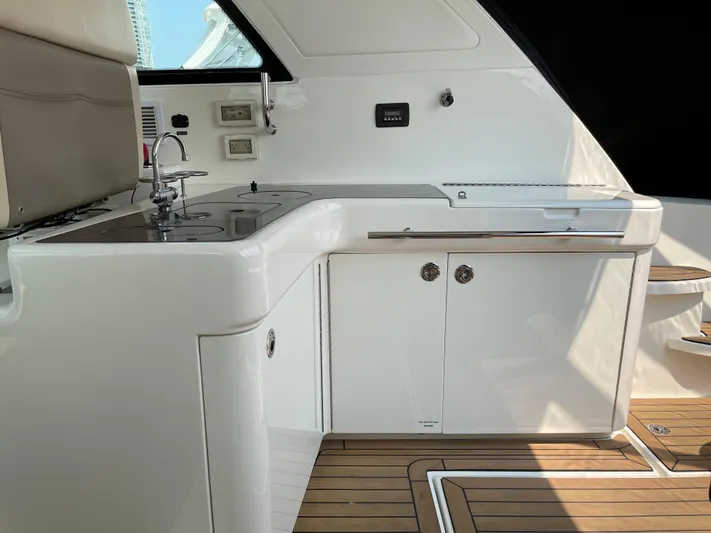  Yacht Photos Pics 2013 Sea Ray 450 Sundancer yacht interior with sleek kitchenette and modern design.