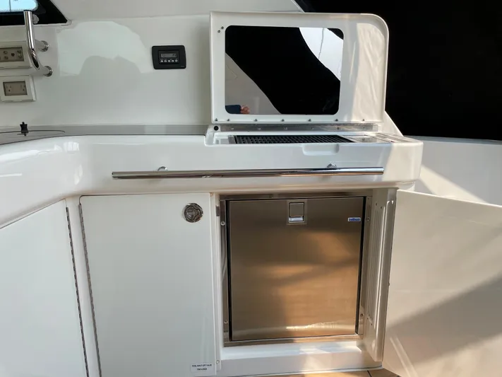  Yacht Photos Pics 2013 Sea Ray 450 Sundancer yacht kitchenette with stainless steel appliances and storage.