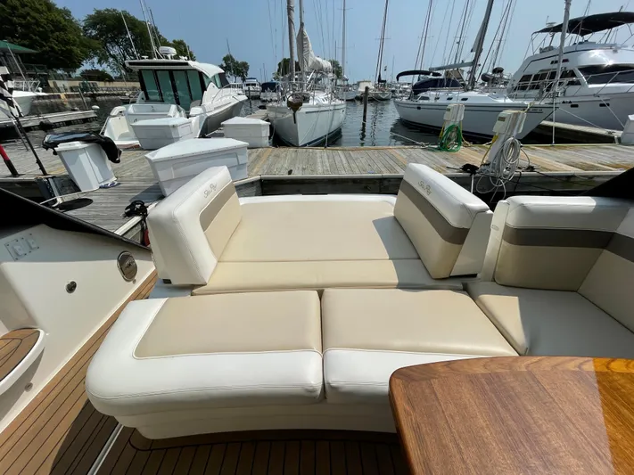  Yacht Photos Pics Luxurious 2013 Sea Ray 450 Sundancer yacht with spacious seating at marina.