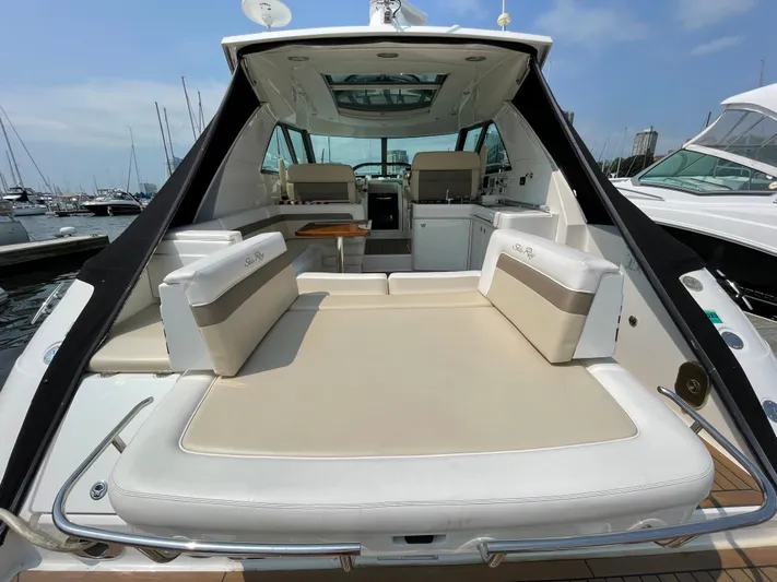  Yacht Photos Pics 2013 Sea Ray 450 Sundancer yacht with spacious seating and sleek design at a marina.