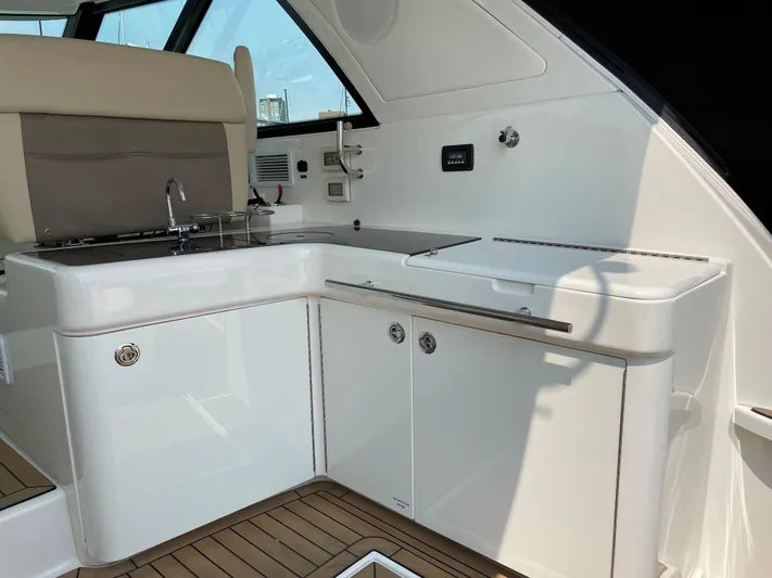  Yacht Photos Pics 2013 Sea Ray 450 Sundancer yacht interior with sleek kitchenette and modern design.