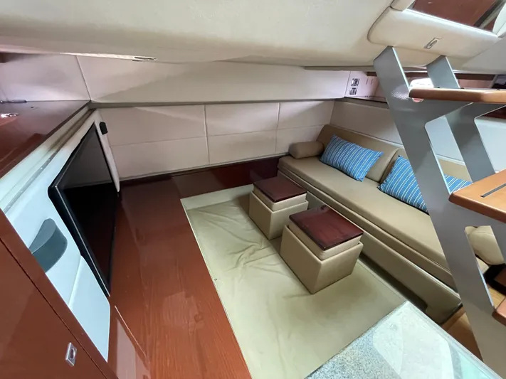  Yacht Photos Pics Interior of 2013 Sea Ray 450 Sundancer yacht with modern seating and wooden accents.