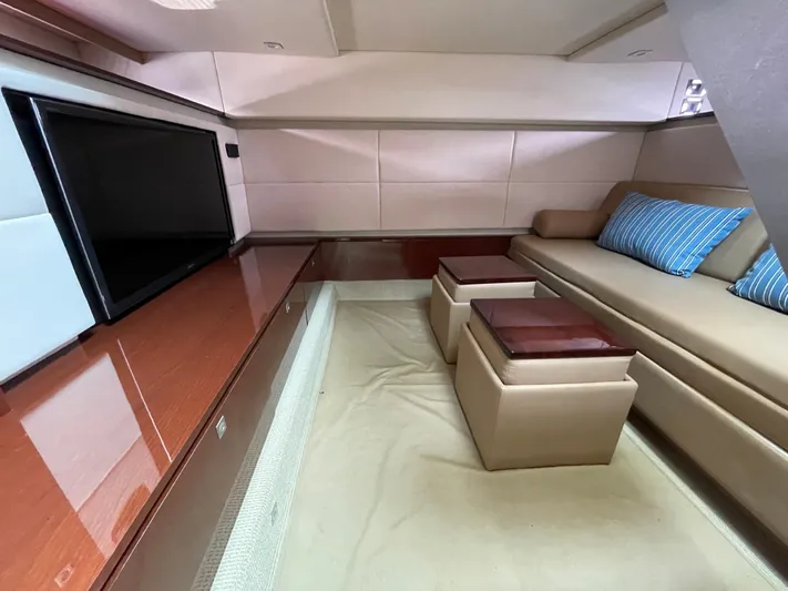  Yacht Photos Pics Luxurious interior of 2013 Sea Ray 450 Sundancer yacht with sofa and TV.
