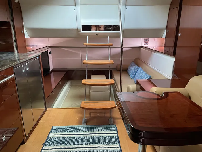  Yacht Photos Pics Interior of 2013 Sea Ray 450 Sundancer yacht with modern kitchen and seating area.