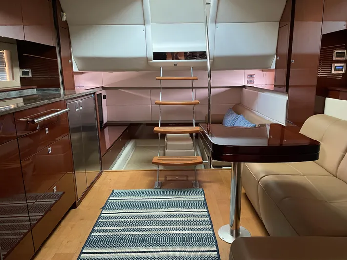  Yacht Photos Pics Interior of 2013 Sea Ray 450 Sundancer yacht with modern kitchen and seating area.