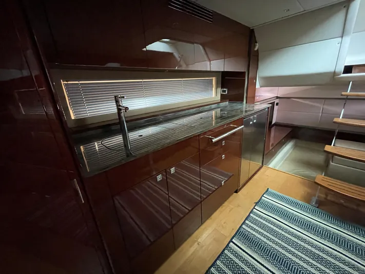  Yacht Photos Pics Luxurious kitchen interior of 2013 Sea Ray 450 Sundancer yacht with sleek cabinetry and modern design.