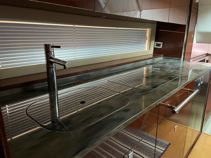  Yacht Photos Pics Luxurious kitchen area in 2013 Sea Ray 450 Sundancer yacht with sleek countertop and modern faucet.