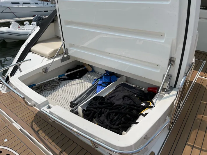  Yacht Photos Pics Open storage compartment on 2013 Sea Ray 450 Sundancer yacht with ropes and equipment.