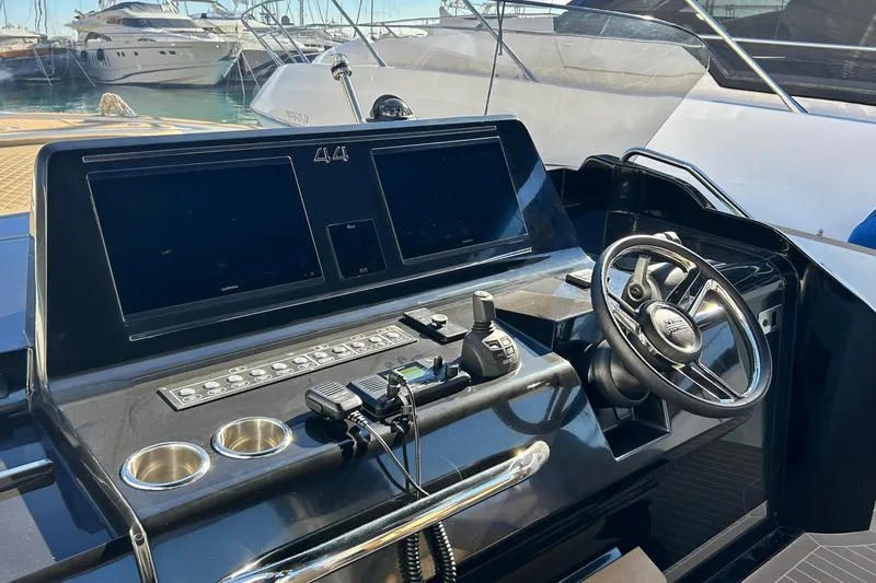  Yacht Photos Pics 2024 Solaris Power 44 Open yacht helm with dual screens and modern controls.