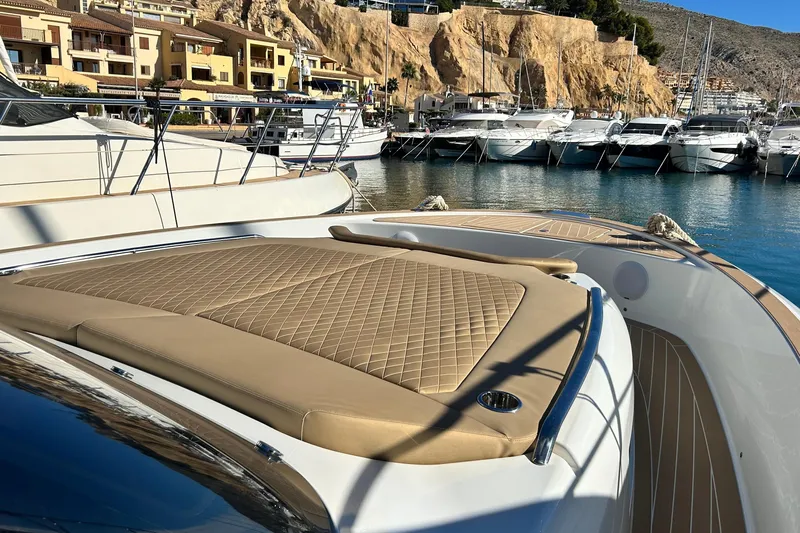  Yacht Photos Pics 2024 Solaris Power 44 Open yacht with luxurious deck in scenic marina.