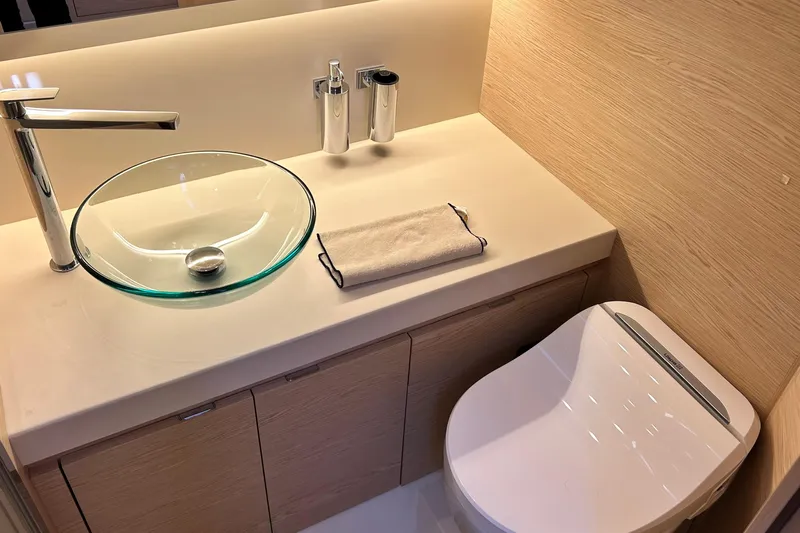  Yacht Photos Pics Luxurious bathroom in 2024 Solaris Power 44 Open yacht with modern fixtures.