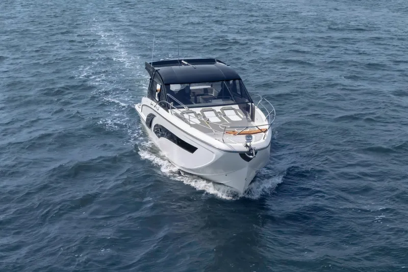  Yacht Photos Pics 2025 Hanover 387 boat cruising on open water, showcasing sleek design and modern features.