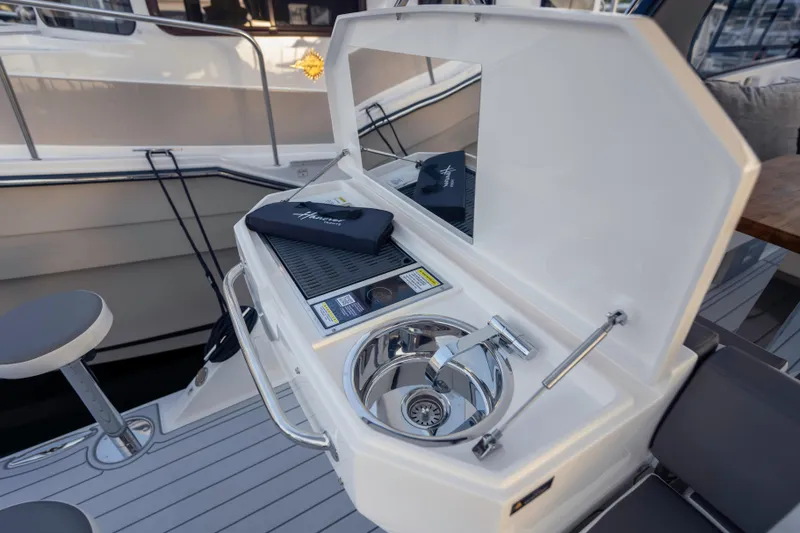  Yacht Photos Pics Outdoor sink and grill on 2025 Hanover 387 yacht deck.