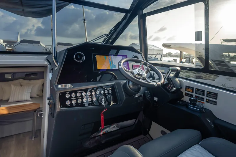  Yacht Photos Pics 2025 Hanover 387 boat cockpit with modern navigation system and luxurious interior.