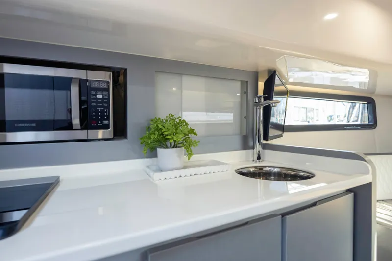  Yacht Photos Pics Modern kitchen interior of Hanover 387 yacht, featuring sleek design and built-in appliances, 2025 model.