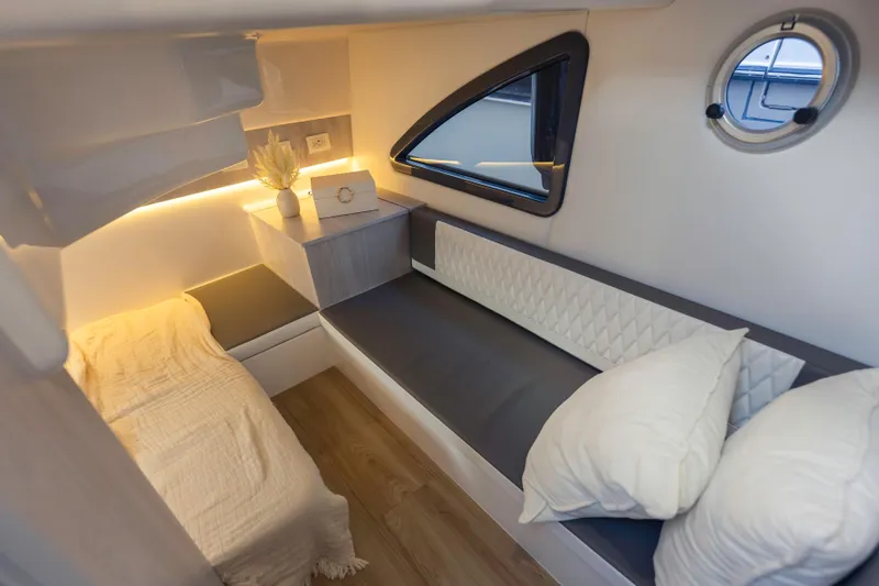  Yacht Photos Pics Modern interior of Hanover 387, 2025 model, featuring cozy seating and ambient lighting.