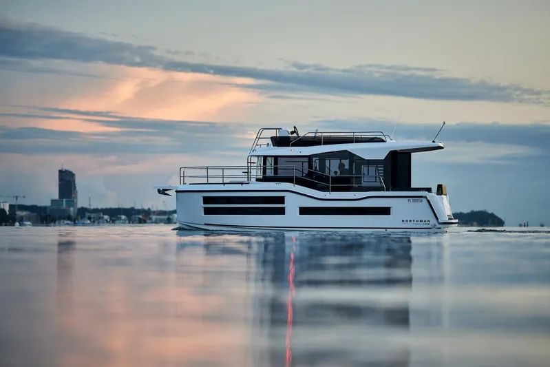 Yacht Photos Pics Modern Northman 1050 yacht on calm water at sunset, 2025 model.