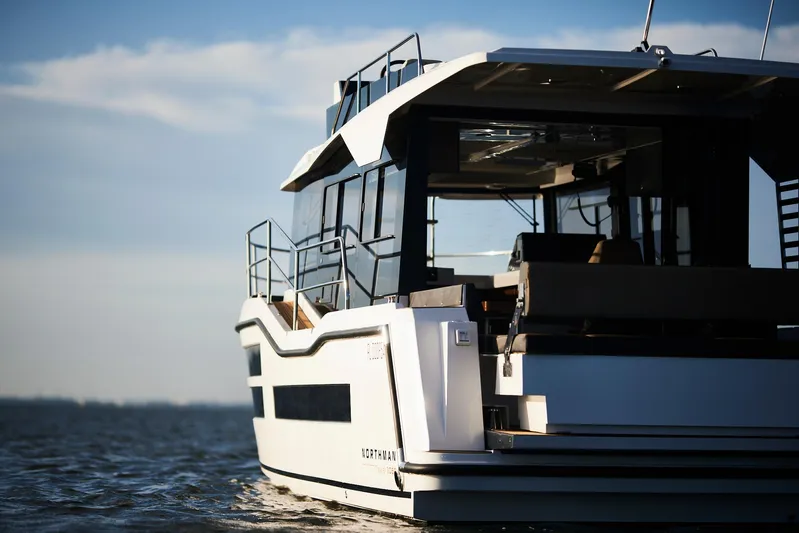  Yacht Photos Pics Modern Northman 1050 yacht on open water, 2025 model, sleek design, sunny day.