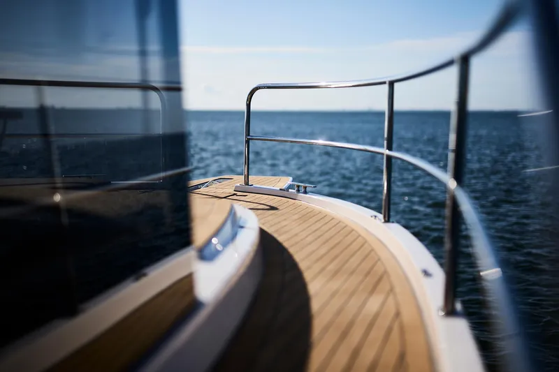  Yacht Photos Pics Sleek Northman 1050 yacht deck overlooking serene ocean, 2025 model.