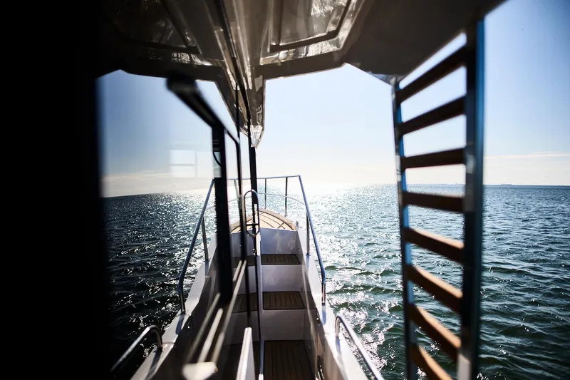  Yacht Photos Pics View from Northman 1050 boat, 2025 model, overlooking sparkling ocean waters.