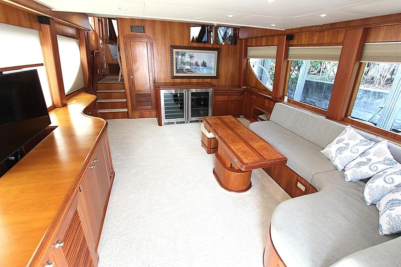 No Name Yacht Photos Pics Luxurious interior of 2001 Symbol 62 Pilothouse yacht with wood finishes and comfortable seating.