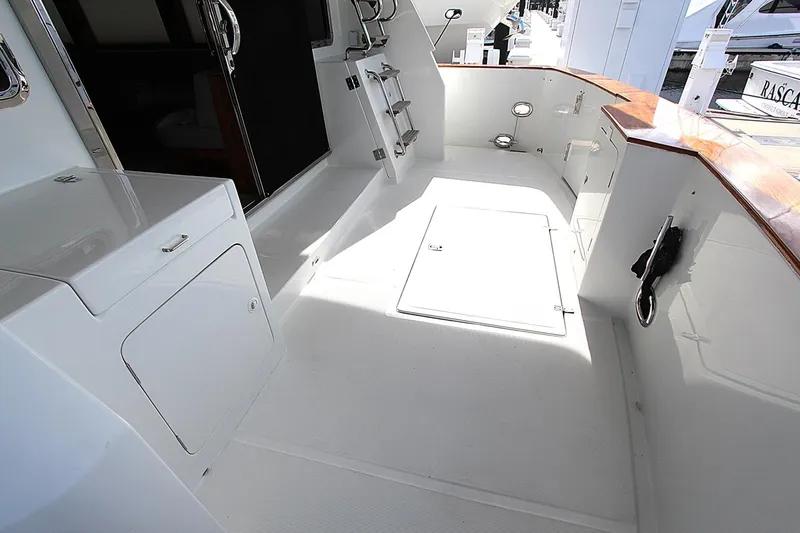 No Name Yacht Photos Pics Spacious deck of 2001 Symbol 62 Pilothouse yacht with storage and ladder.