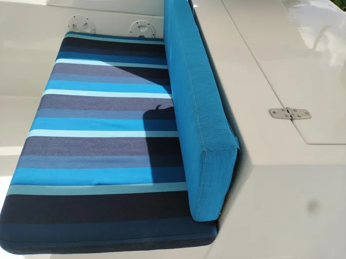 No Name Yacht Photos Pics Blue striped cushion on a 2001 Symbol 62 Pilothouse boat seat.