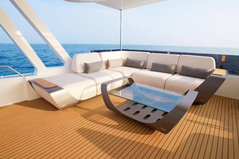  Yacht Photos Pics Luxurious 2025 Mazarin 55 EVO II yacht interior with modern seating and ocean view.