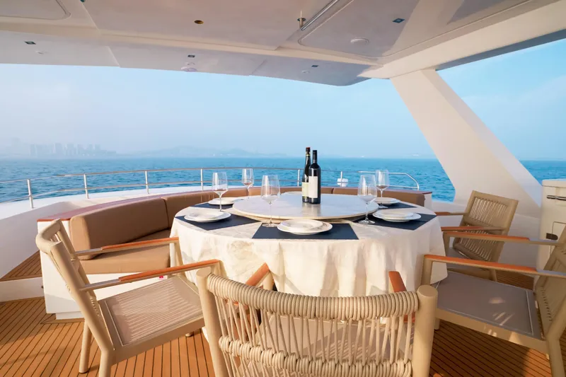  Yacht Photos Pics Luxury dining setup on Mazarin 55 EVO II yacht, 2025, with ocean view.