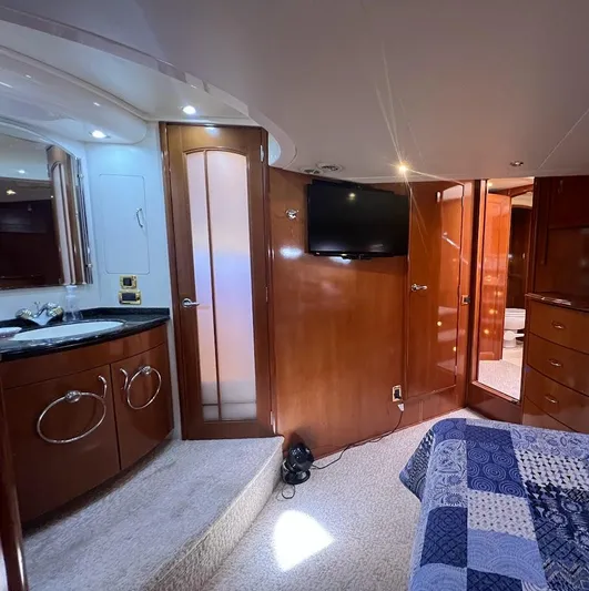 Roweboat Yacht Photos Pics Interior of 2006 Carver Voyager Sky Lounge with wood finishes and modern amenities.